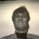Still from Sequence 14 of Idea Demonstrations. Mike Parr stares into a bright light until he blinks.
