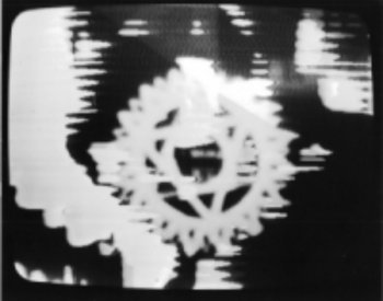 Frame from Syntheses: with computer graphic mandala.